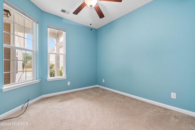 carpeted empty room with ceiling fan