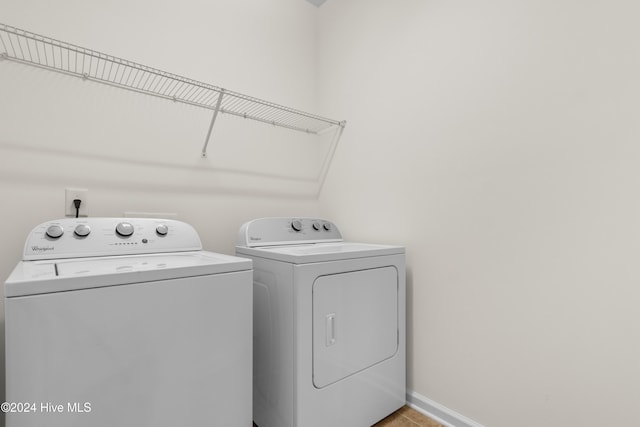 laundry area with washing machine and dryer