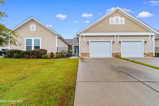 front of property with a garage and a front yard