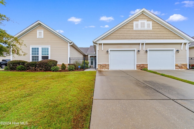 1562 Palmina Loop, Myrtle Beach, SC 29588 - view of front of house with concrete driveway, a front lawn, and a garage