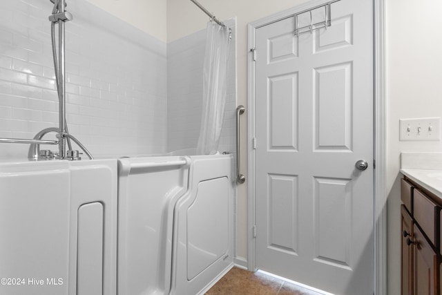 bathroom with vanity and tile patterned flooring