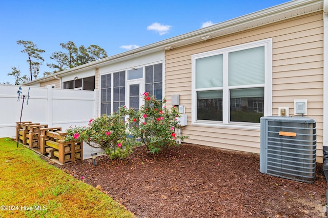 view of side of home featuring central air condition unit