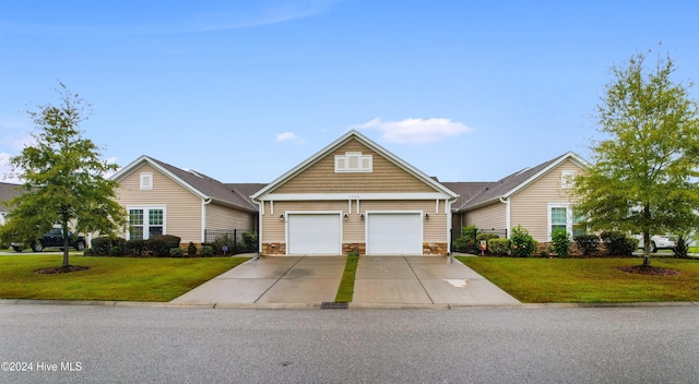 1562 Palmina Loop, Myrtle Beach, SC 29588 - view of front facade with a front lawn, stone siding, and concrete driveway