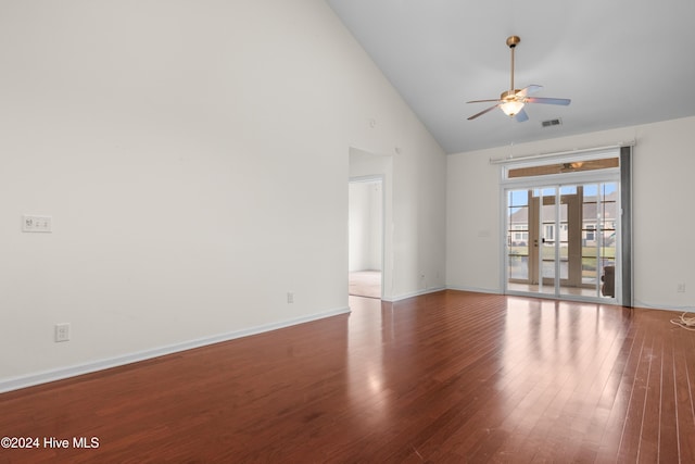 unfurnished room featuring french doors, high vaulted ceiling, wood-type flooring, and ceiling fan