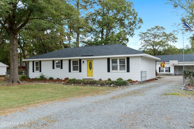 ranch-style house with a front lawn