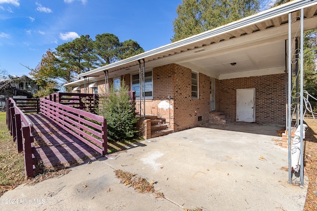 view of patio featuring a carport