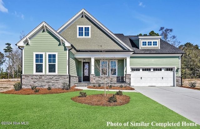 craftsman-style home featuring a front yard