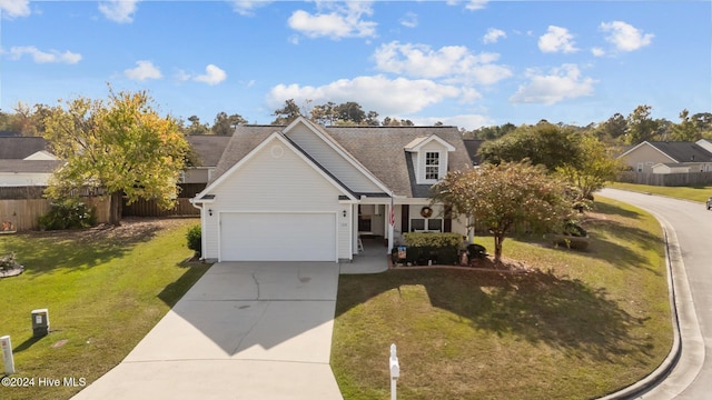 view of front of property with a front lawn and a garage