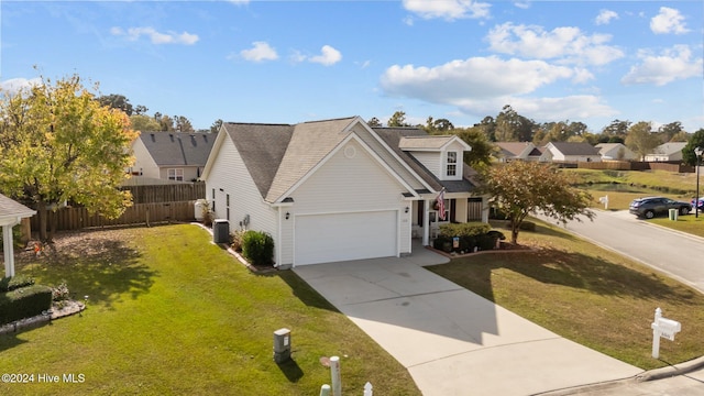 view of front of home featuring a garage and a front yard