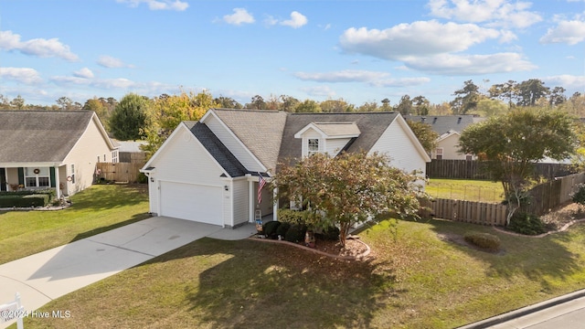 view of front of home featuring a front lawn and a garage