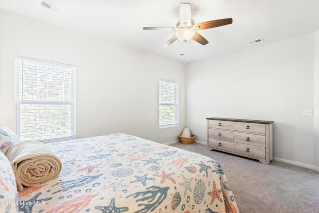 bedroom featuring ceiling fan and light carpet