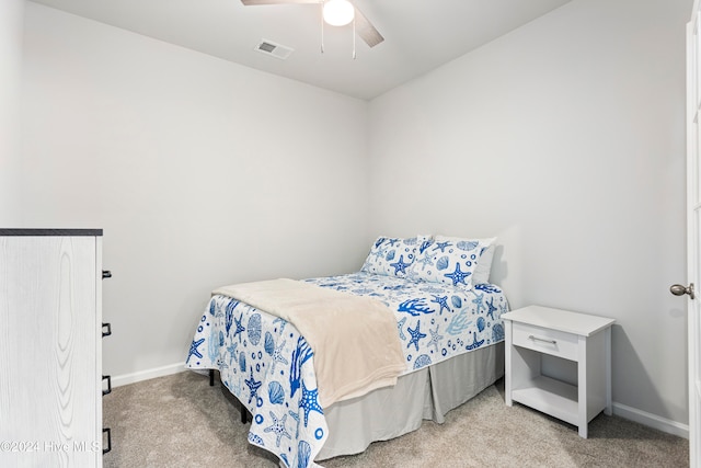 bedroom featuring ceiling fan and light colored carpet