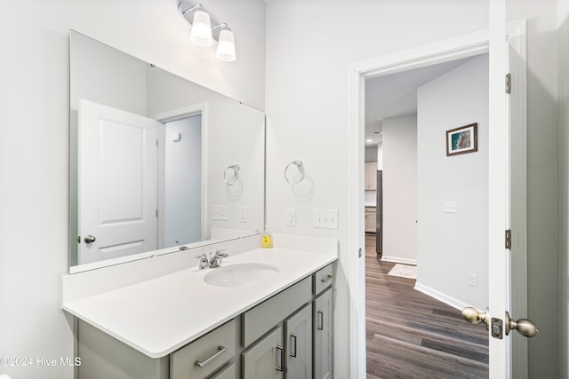 bathroom featuring vanity and hardwood / wood-style flooring