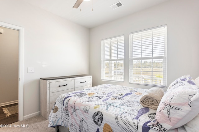 carpeted bedroom with ceiling fan