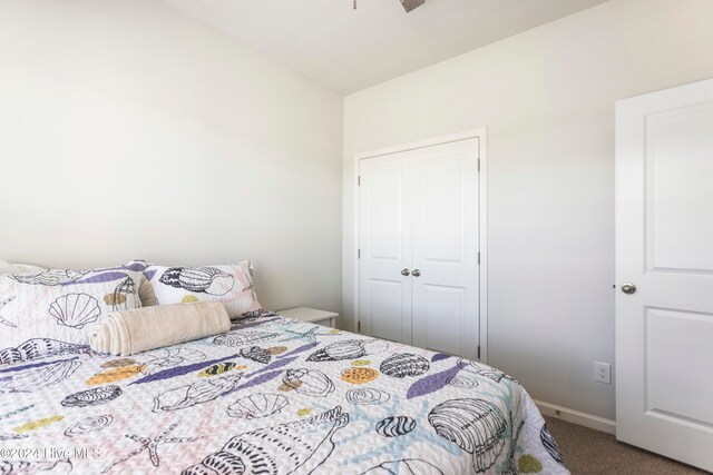 carpeted bedroom featuring a closet