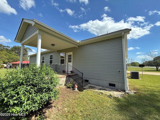 1535 Ghio Rd, Hamlet, NC 28345 - rear view of house featuring crawl space, a yard, and central air condition unit