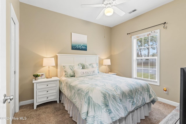 bedroom featuring light carpet and ceiling fan