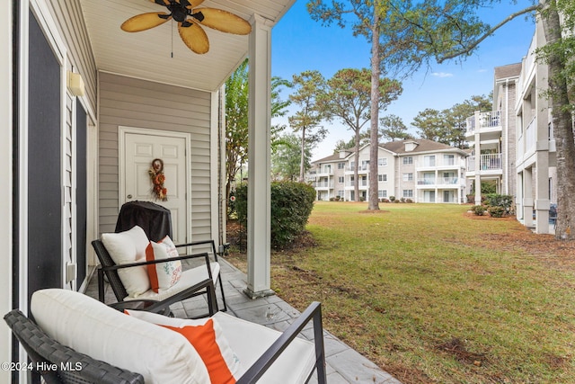 exterior space featuring ceiling fan