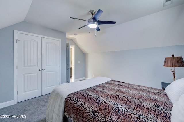 bedroom featuring visible vents, lofted ceiling, carpet, and a closet