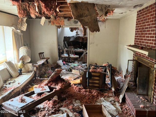 miscellaneous room with a brick fireplace