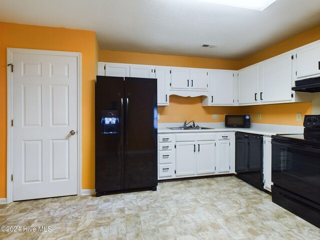 kitchen featuring sink, white cabinets, black appliances, and range hood