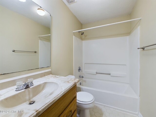 full bathroom with a textured ceiling, vanity, toilet, and shower / tub combination