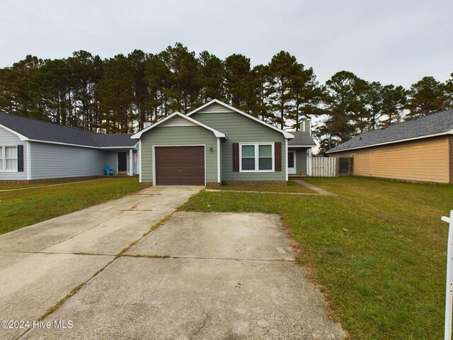 single story home with a front yard and a garage