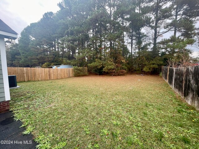 view of yard with central AC unit