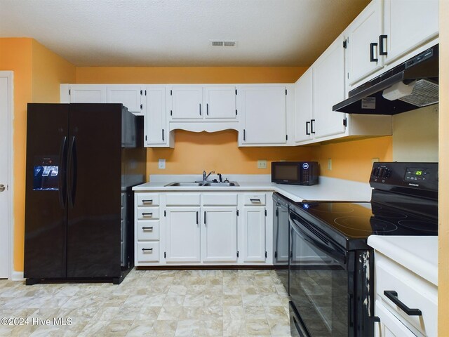 kitchen featuring white cabinetry, sink, and black appliances