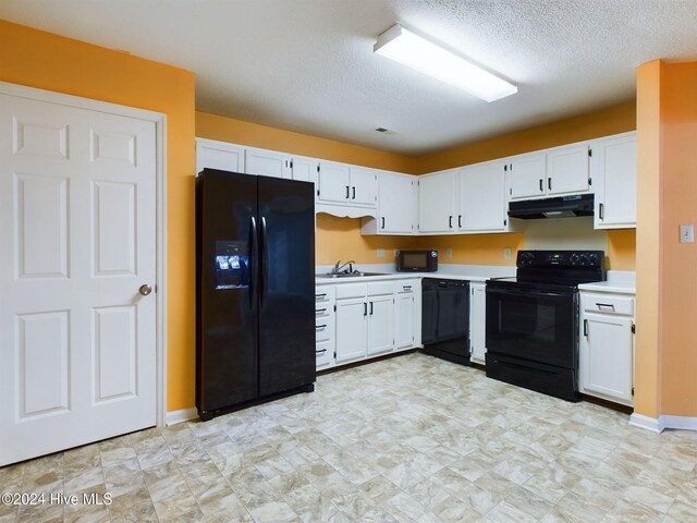 kitchen featuring white cabinets, a textured ceiling, sink, and black appliances