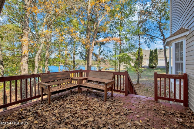 wooden terrace with a water view