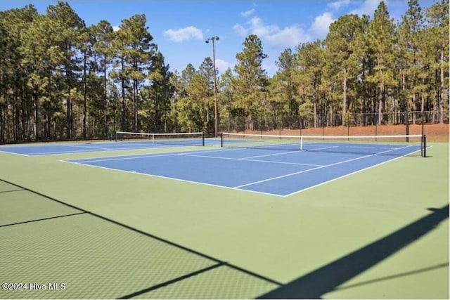 view of tennis court with basketball court