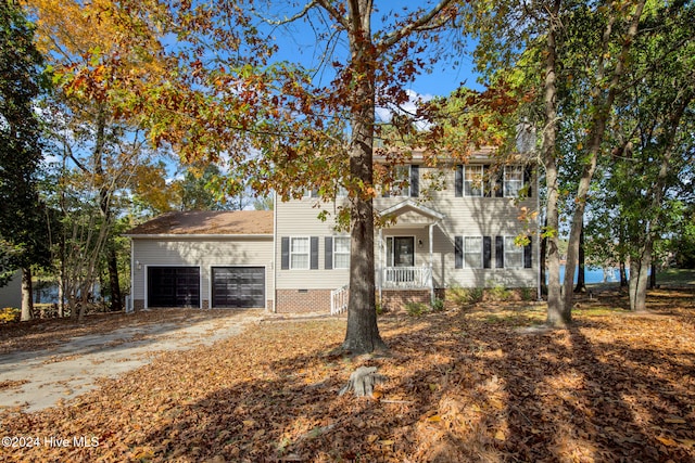 colonial inspired home featuring a garage