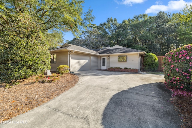 ranch-style home featuring a garage