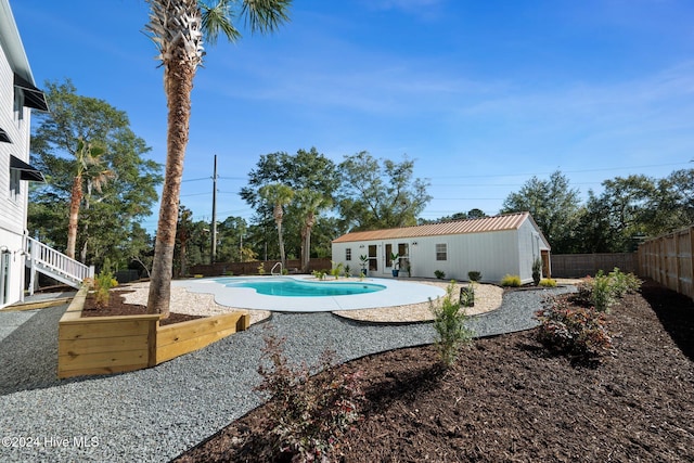 view of pool featuring an outdoor structure