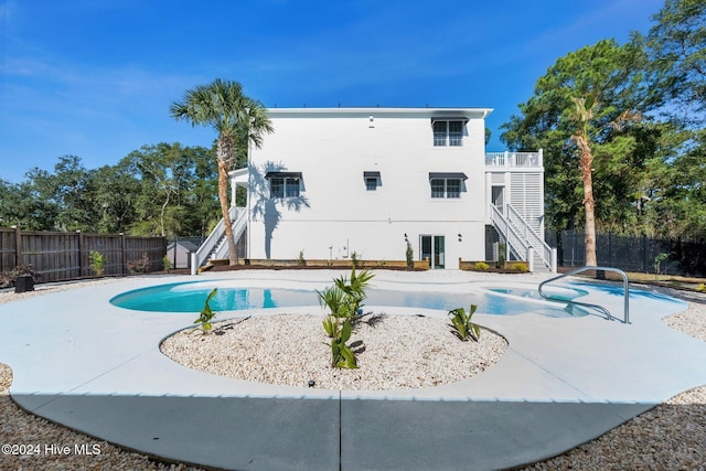 view of swimming pool featuring stairs, a patio, a fenced backyard, and a fenced in pool