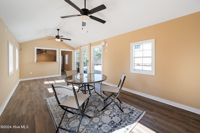 dining space featuring ceiling fan, dark hardwood / wood-style floors, and vaulted ceiling