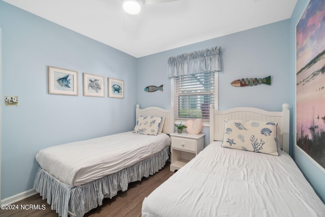 bedroom featuring dark wood-type flooring