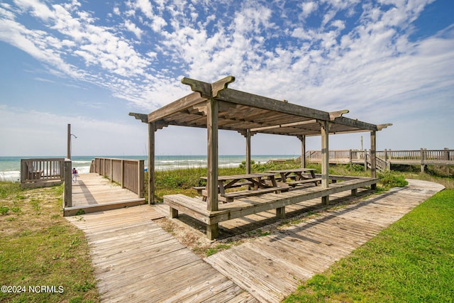 view of property's community featuring a view of the beach and a water view