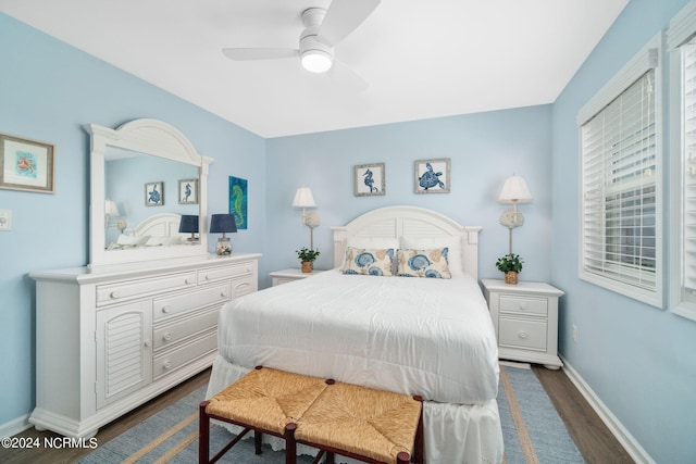 bedroom featuring dark wood-type flooring and ceiling fan