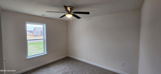 carpeted empty room with ceiling fan