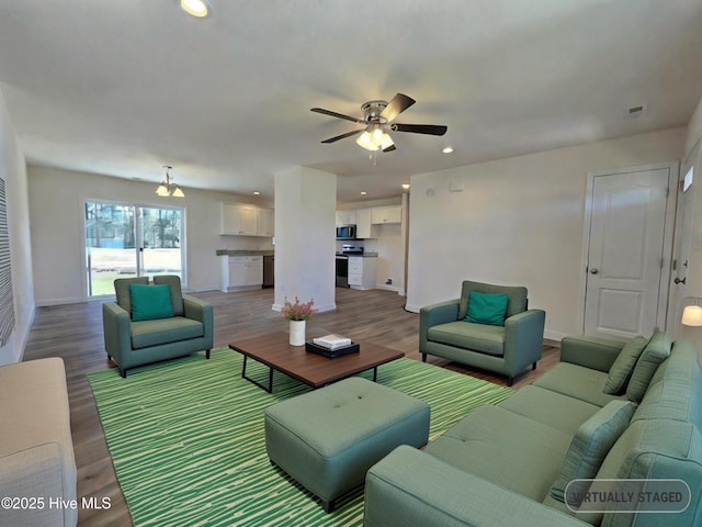 living room featuring ceiling fan and wood-type flooring