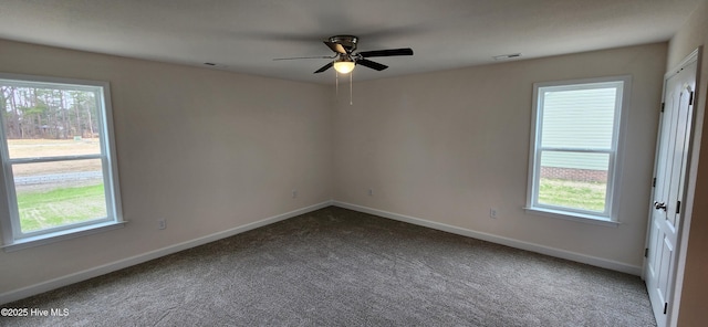 empty room with ceiling fan and carpet flooring