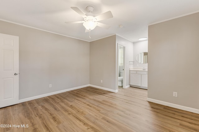 unfurnished room with ceiling fan, crown molding, and light hardwood / wood-style flooring