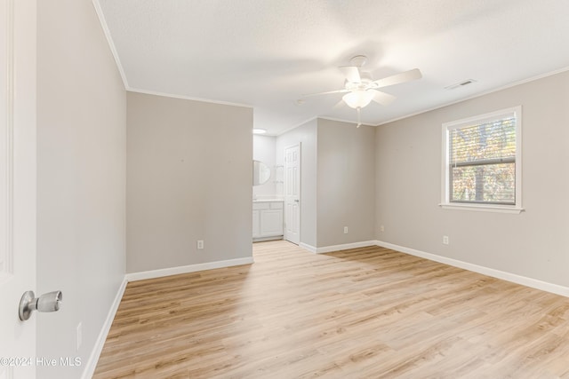 unfurnished room with ceiling fan, light hardwood / wood-style flooring, and crown molding