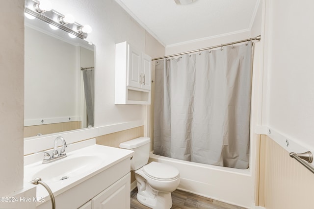 full bathroom featuring hardwood / wood-style floors, toilet, shower / tub combo with curtain, vanity, and ornamental molding