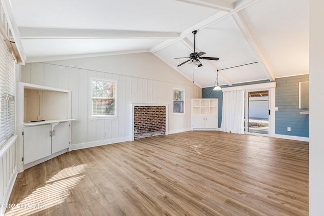 unfurnished living room featuring vaulted ceiling with beams, light hardwood / wood-style floors, and ceiling fan