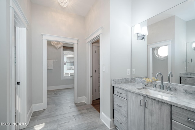 bathroom with hardwood / wood-style flooring and vanity