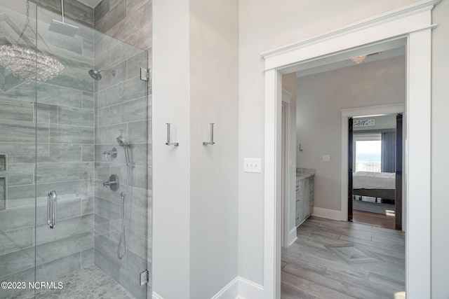 bathroom with walk in shower and vanity