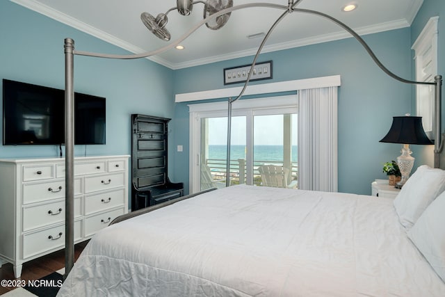 bedroom featuring dark hardwood / wood-style flooring, crown molding, access to outside, and a water view